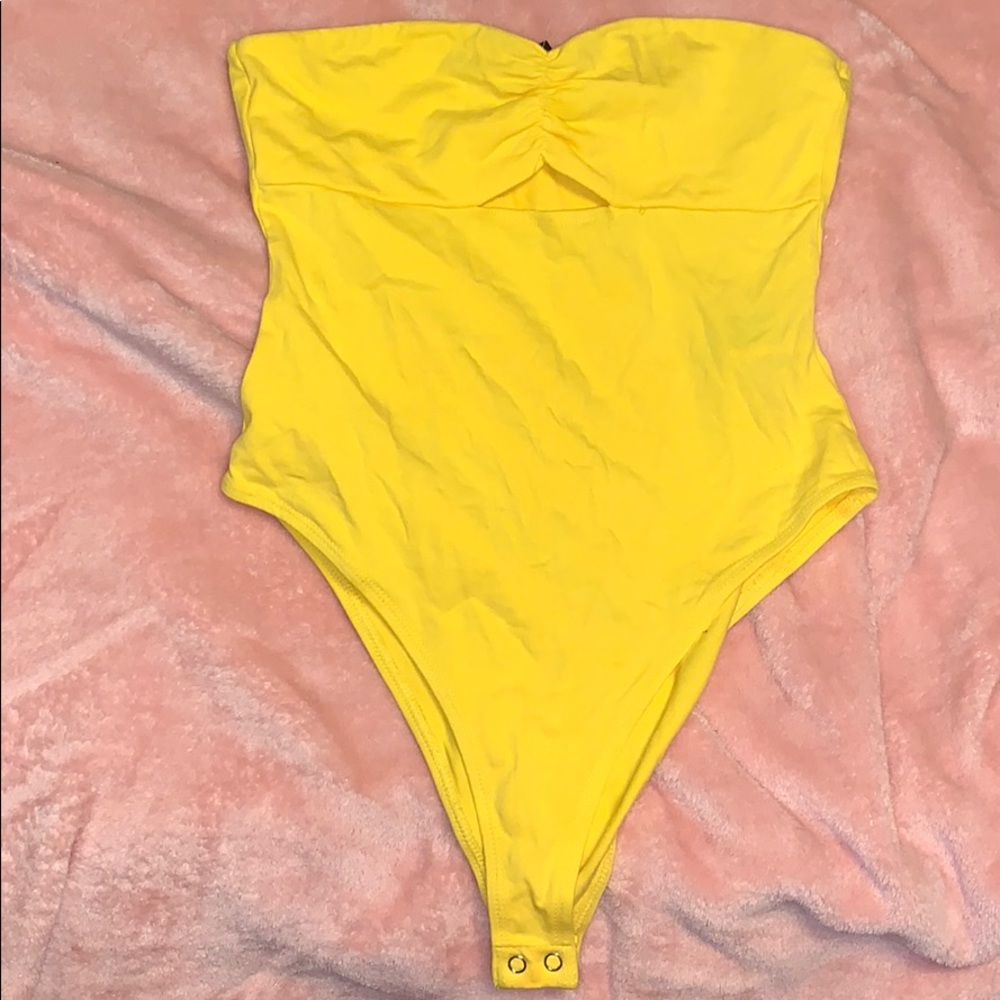 Yellow cut out tube top bodysuit
